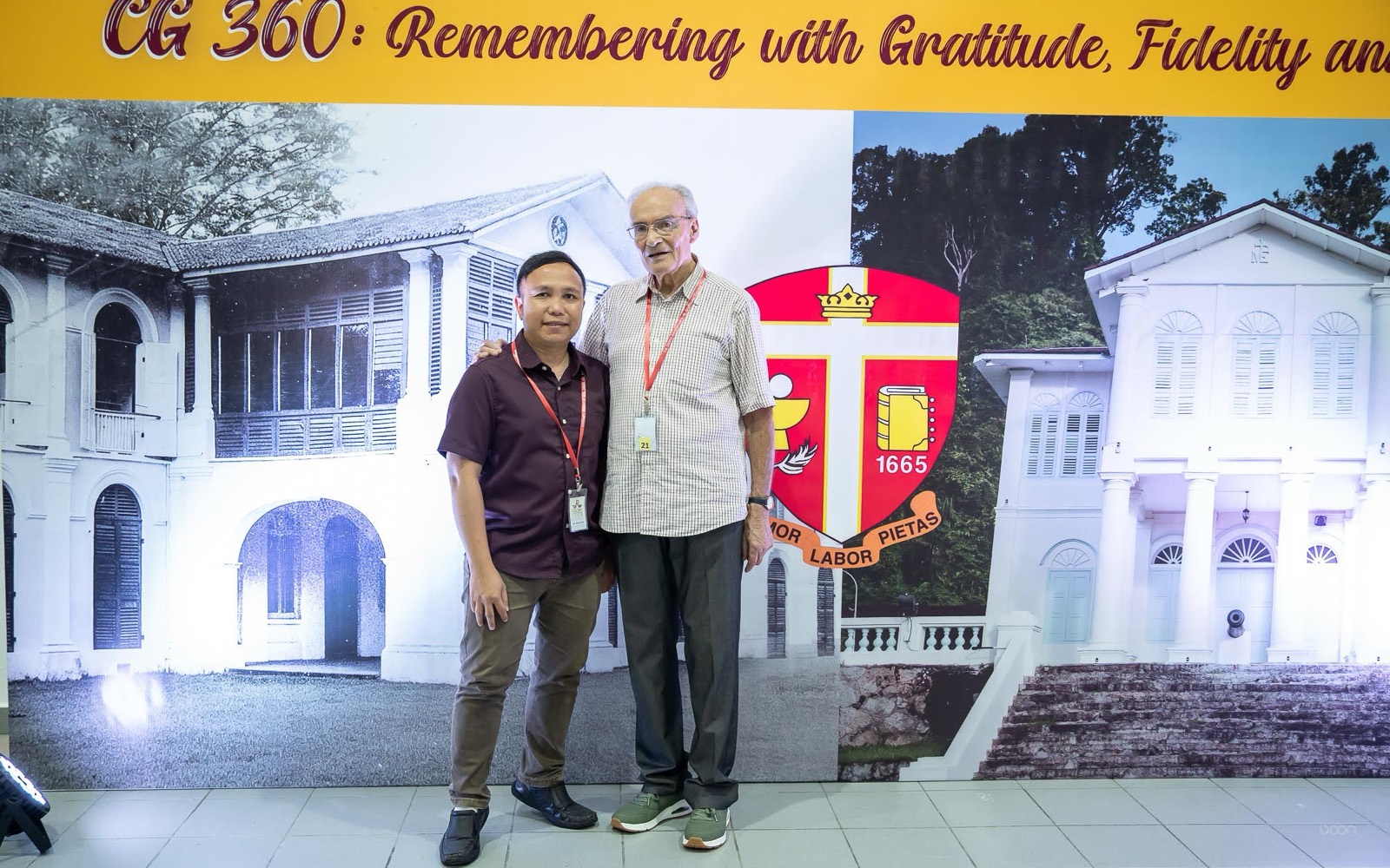 Two friends of the seminary before the CG 360 backdrop