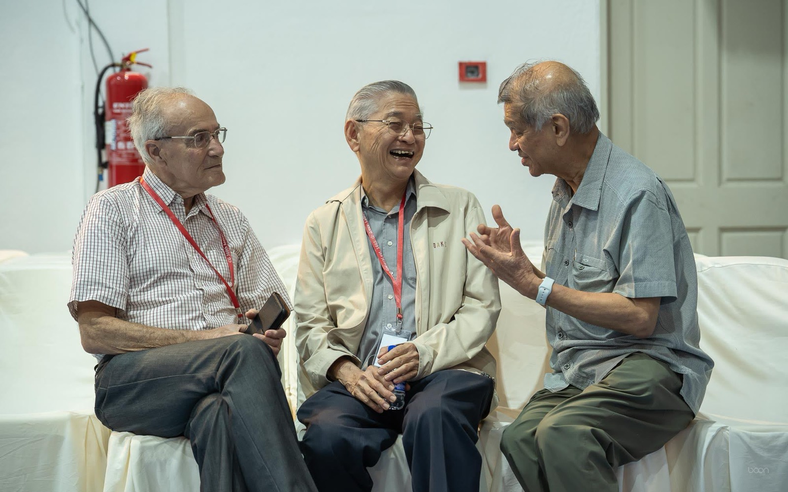 Three alumni in conversation at the reunion
