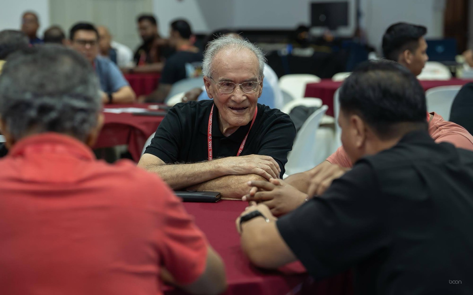 An alumnus in conversation over dinner