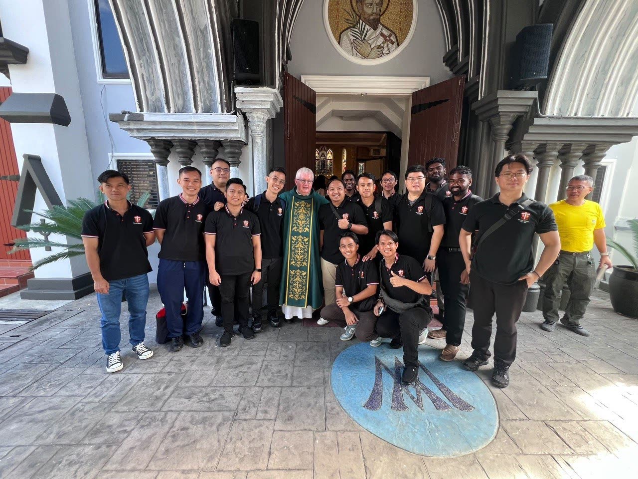 Members of the community gathered at the seminary entrance