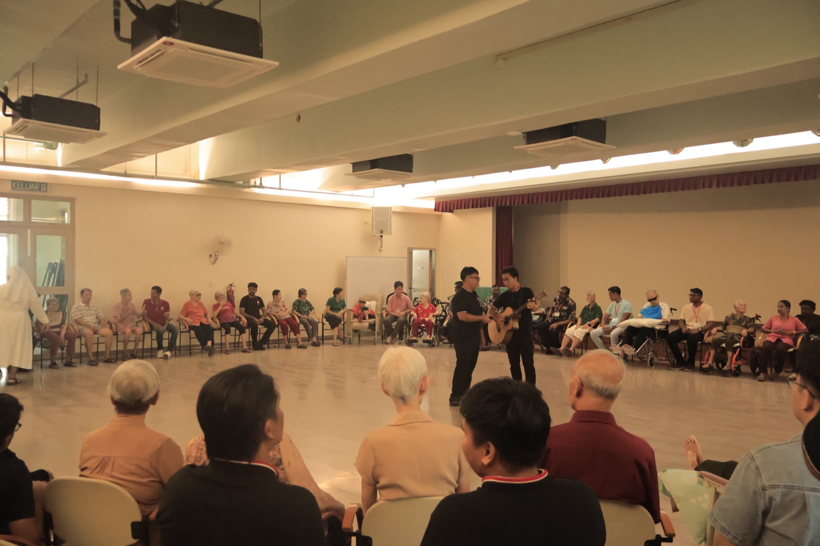 An afternoon programme with elderly residents in the community hall