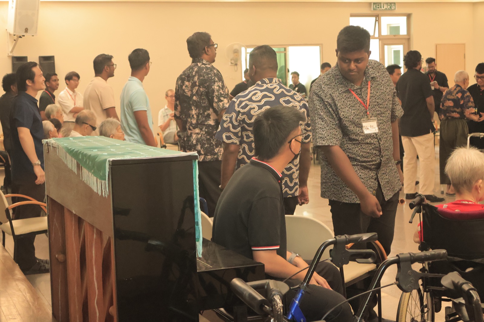 A seminarian serving a resident at a care home