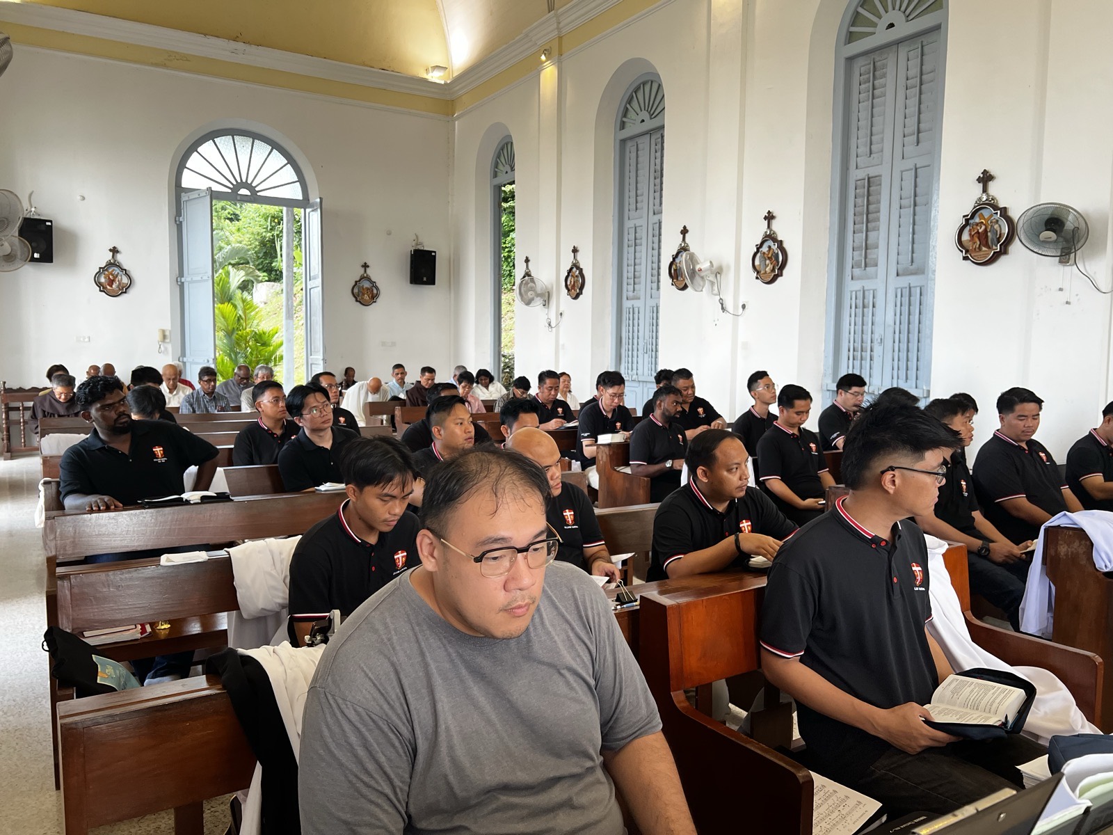 Seminarians listening to a reflection in the chapel